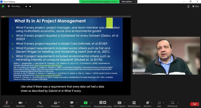 Image: speaker (Dr. Ushnish Sengupta @ultush) in Zoom with slide titled "What Ifs in AI Project Management"