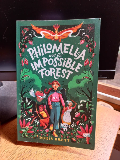 Photo shows a copy of the book 'Philomella and the Impossible Forest' by Doris Brett