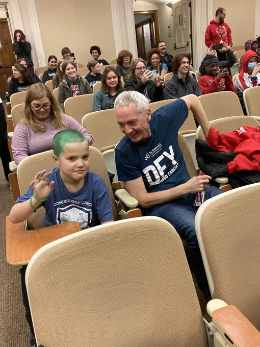 A student has green hair to support St. Baldrick's
