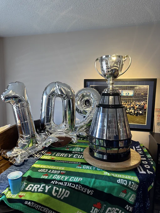 Our piano, festooned with the Grey Cup itself