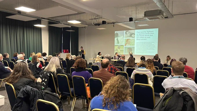 Audience and guests at a panel discussing The Future of Film Programming at the Community Cinema Conference.