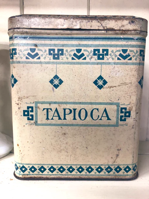 A vintage blue and white Tapioca storage tin