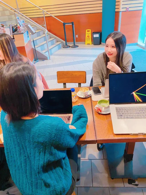 An impromptu mentoring session between two devs at a coffee shop.