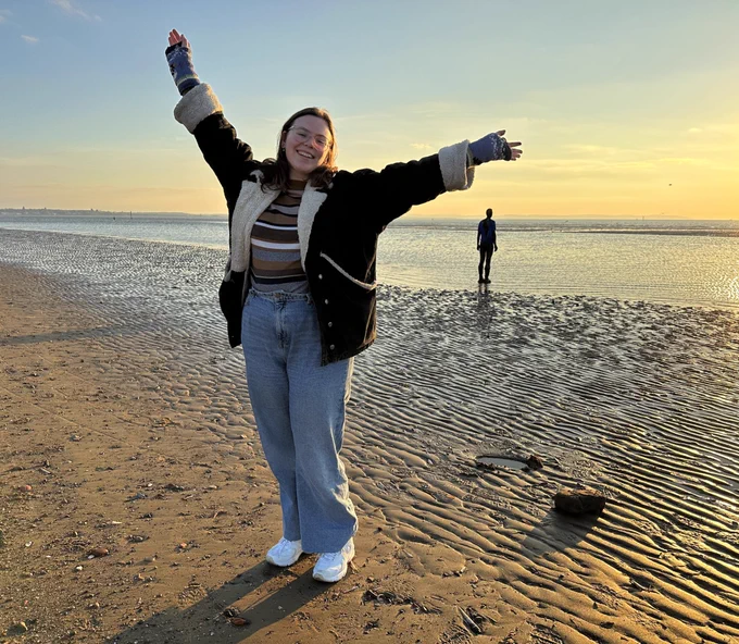 Photo of Clare, a young woman, at the beach