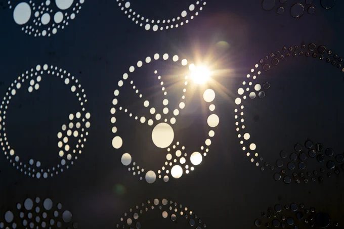 A photo of sunlight passing through an abstract shape