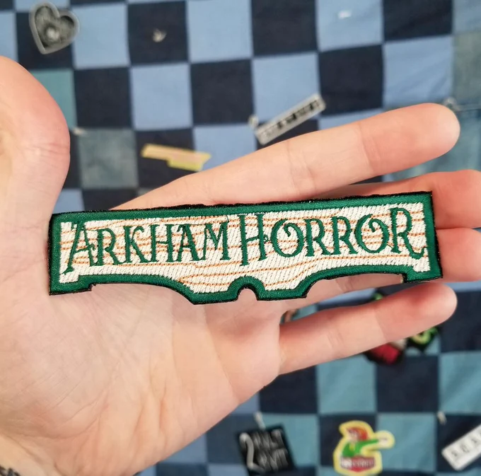 Embroidered patch for the board game Arkham Horror.