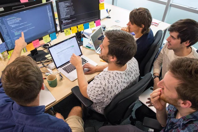 a group of people doing mob programming an open practice
