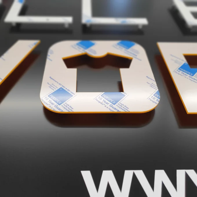 CNC letters being test fitted to the tray sign.