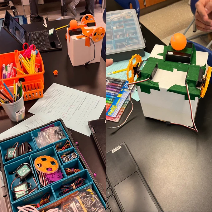 Two photos of equipment on black tables. The equipment includes motors, gears, wires, tape, and cardboard. Two boxes have motors and wheels taped to them with wires sticking out.