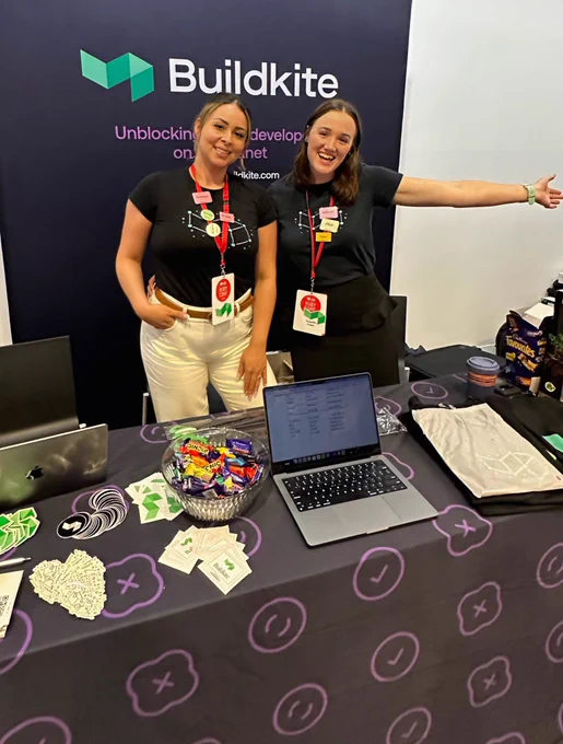 The Buildkite team at their RubyConf AU 2023 booth.