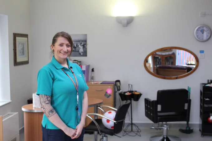 Activity co-ordinator Vicky Watson smiles inside the new activity room