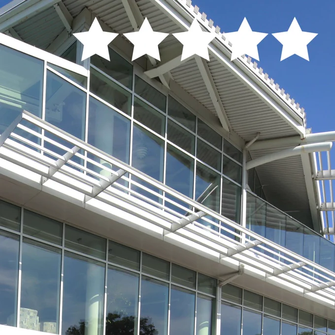A photo of the exterior of the building with 5 stars.