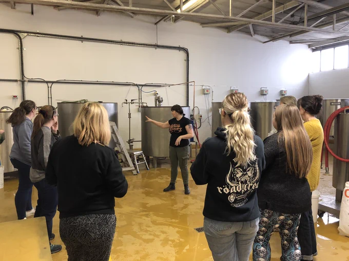 A group of ladies listening to Neptune Brewery co-owner Julie talk about the mash tun before we mash in the grains for today’s beer