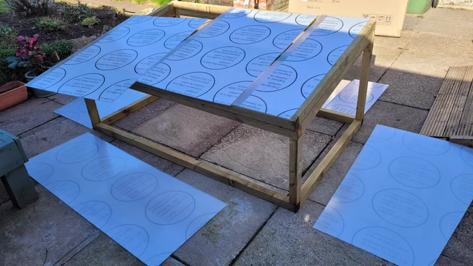 Wooden frame with corrugated plastic sheets