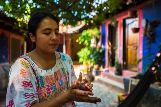 Woman making chocolate with her hands 