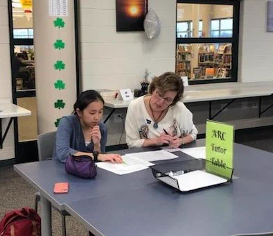 ARC writing tutor Maddie helps Monica Caldicott edit a grant application.