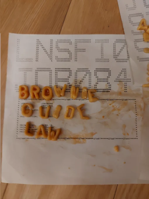 The words Brownies Guide Law spelt out using alphabetti spaghetti 