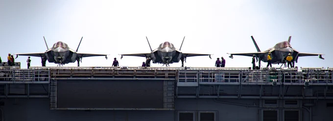 F-35B Lightning II aircraft from Marine Fighter Attack Squadron (VMFA) 122, 13th Marine Expeditionary Unit (MEU), rest aboard the Wasp-class amphibious assault ship USS Makin Island (LHD 8). Nimitz Carrier Strike Group (NIMCSG) and Makin Island Amphibious Ready Group (MKI ARG), with embarked 13th MEU, are conducting combined expeditionary strike force (ESF) operations, demonstrating unique high-end war fighting capability, maritime superiority, power projection and readiness. Operations include integrated training designed to advance interoperability between the two groups while simultaneously demonstrating the U.S. commitment to our alliances and partnerships in the Indo-Pacific region. (U.S. Navy photo by Mass Communication Specialist 2nd Class David Rowe)