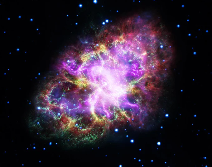 This image of the tentacle-like Crab Nebula against the dark backdrop of space combines data from five different telescopes: the VLA (radio) in red; Spitzer Space Telescope (infrared) in yellow; Hubble Space Telescope (visible) in green; XMM-Newton (ultraviolet) in blue; and Chandra X-ray Observatory (X-ray) in purple
Image credit: Image Credit: NASA, ESA, NRAO/AUI/NSF and G. Dubner (University of Buenos Aires)