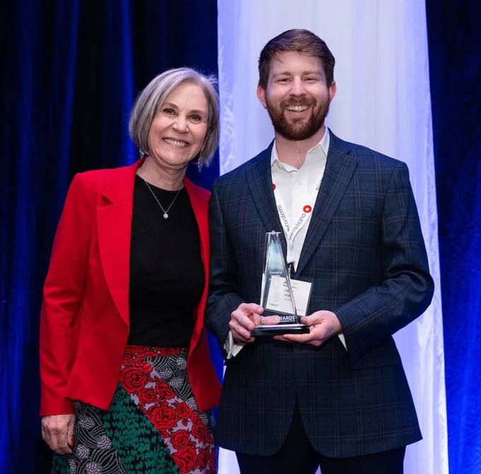 Frannie Matthews presents the Emerging Leader of the Year Award to Drew Port at the CTA APEX Awards.