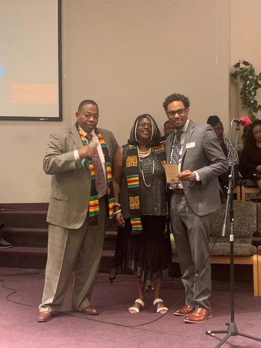 Photo of Colorado Teacher of the Year Jimmy Day accepting his Educartion Champion Award from leaders of the Colorado Black Caucus of School Board Directors