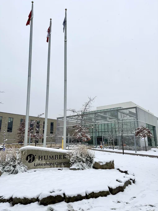 Snow covers the ground outside a building at Humber Lakeshore campus
