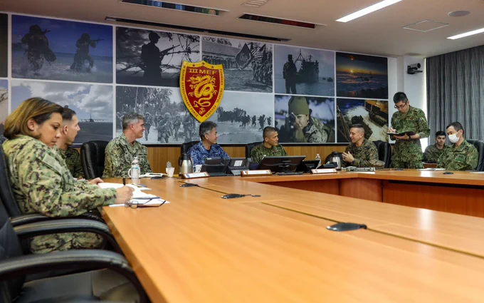 U.S. Marine Brig. Gen. Fridrik Fridriksson, deputy commander Task Force 76/3, third-from-right, speaks to U.S. Navy Rear Adm. Derek Trinque, commander Task Force 76/3, left, Japanese Maritime Self-Defense Force Rear Admiral Motoyuki Kanezashi, commander, Amphibious and Mine Warfare Force, left-center, and Japanese Ground Self-Defense Force Maj. Gen. Shingo Nashinoki, commander, Amphibious Rapid Deployment Brigade, right-center, at a meeting during Iron Fist 23 aboard Camp Courtney, Okinawa, Japan, Feb. 16, 2023. This visit took place during Exercise Iron Fist and provided an overview of TF 76/3, focusing on the command-and-control structure and command position, and how it improves the commander’s ability to control forces and command from ashore without the need to embark. Iron Fist is a U.S. Marine Corps Forces Pacific-directed, 31st Marine Expeditionary Unit-executed, bilateral training exercise between the U.S. Marine Corps and the Japan Ground Self-Defense Force and aims to improv