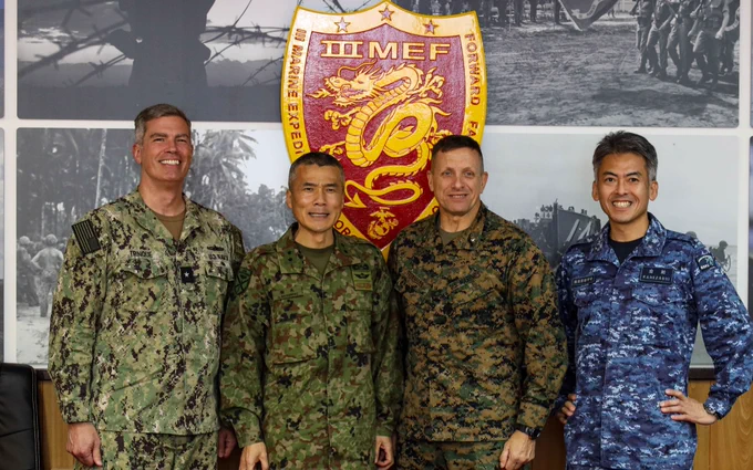 U.S. Navy Rear Adm. Derek Trinque, commander Task Force 76/3, left, Japanese Maritime Self-Defense Force Rear Admiral Motoyuki Kanezashi, commander, Amphibious and Mine Warfare Force, left-center, Japanese Ground Self-Defense Force Maj. Gen. Shingo Nashinoki, commander, Amphibious Rapid Deployment Brigade, right-center, and U.S. Marine Brig. Gen. Fridrik Fridriksson, deputy commander TF 76/3, right, pose for a photo during Iron Fist 23 aboard Camp Courtney, Okinawa, Japan, Feb. 16, 2023. This visit took place during Exercise Iron Fist and provided an overview of TF 76/3, focusing on the command-and-control structure and command position, and how it improves the commander’s ability to control forces and command from ashore without the need to embark. Iron Fist is a U.S. Marine Corps Forces Pacific-directed, 31st Marine Expeditionary Unit-executed, bilateral training exercise between the U.S. Marine Corps and the Japan Ground Self-Defense Force and aims to improve staff planning, enhance
