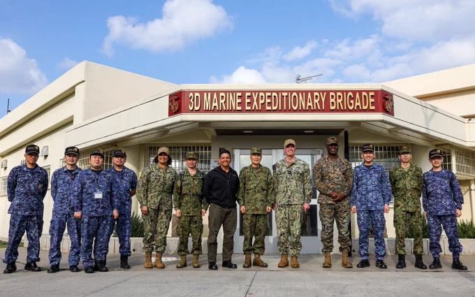 U.S. Marines and Sailors from Task Force 76/3 pose for a photo with service members from the Japanese Maritime and Ground Self-Defense Forces during Iron Fist 23 aboard Camp Courtney, Okinawa, Japan, Feb. 16, 2023. This visit to Task Force 76/3 took place during Exercise Iron Fist 23 and provided an overview of TF 76/3, focusing on the command-and-control structure and command position, and how it improves the commander’s ability to control forces and command from ashore without the need to embark. Iron Fist 23 is a U.S. Marine Corps Forces Pacific-directed, 31st Marine Expeditionary Unit-executed, bilateral training exercise between the U.S. Marine Corps and the Japan Ground Self-Defense Force and aims to improve staff planning, enhance core competencies in amphibious operations and interoperability, and maintain a positive military-to-military relationship between Japan and the United States. (U.S. Marine Corps photo by Staff Sgt. Andrew Ochoa)

