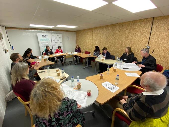 Picture of a small business representatives sitting around a table