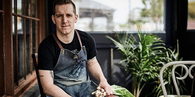 chef holding scallions