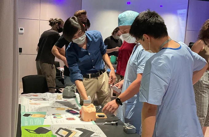 Photo shows exhibition with students to discuss their projects with neurosurgeons, as well as clinicians from other specialisations such as ear, nose and throat (ENT) surgery and the intensive care unit