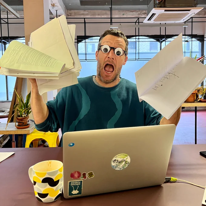 Alex looking stressed with admin and paperwork