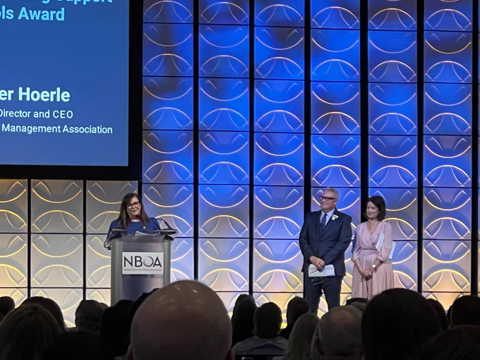 Photo of Heather Hoerle receiving the NBOA award