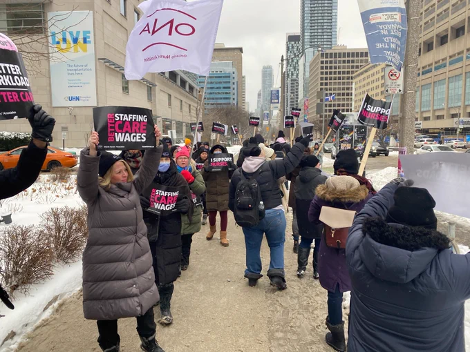 Our picket up and down the sidewalk under an ONA flag.