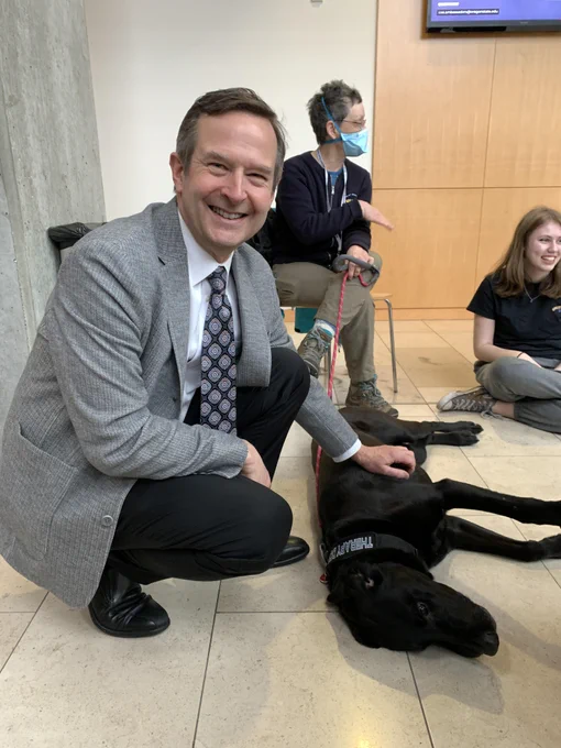 Scott Ashford petting a dog. 