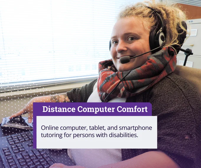 person in a wheelchair wearing a headset smiles while using a computer. Text: Online computer, tablet and smartphone tutoring for persons with disabilities