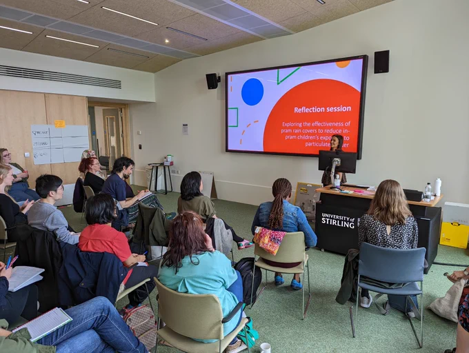 Photo of one of the session's at last year's workshop with a presentation on the reflections of using participatory methods