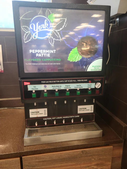A gas station cappuccino machine advertises York Peppermint Pattie flavored cappuccino.