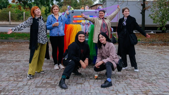 Photo of six activists from KharkivPride, during their pride celebration in 2022. 