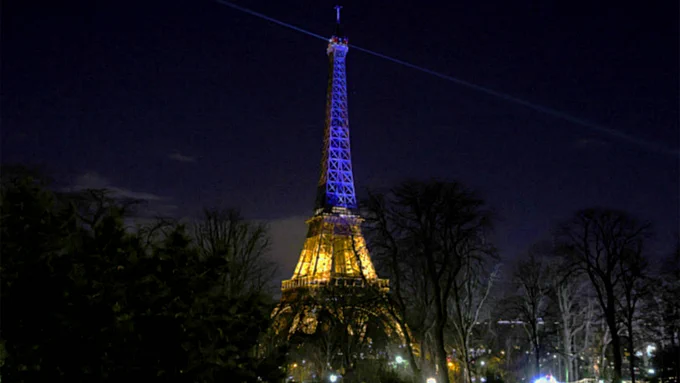 Eiffel tower in colors of Ukrainian flag.