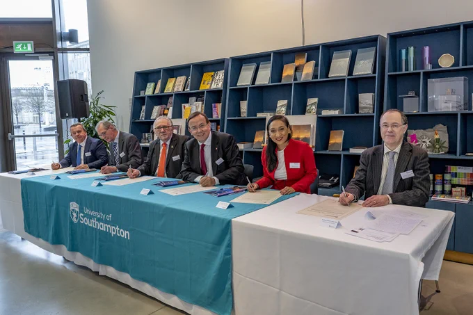 Group sat at table to sign the Civic Agreement. Pictured from left to right: Cllr Rob Humby (Leader of Hampshire County Council ), Cllr Philip Bunday (Cabinet Member for Planning at Test Valley Borough Council), Cllr Derek Preety (Cabinet Lead for Economy at Eastleigh Borough Council), Councillor Martin Tod, (Leader of Winchester City Council), Councillor Satvir Kaur (Leader of Southampton City Council), Professor Mark E Smith (University of Southampton Vice-Chancellor) 