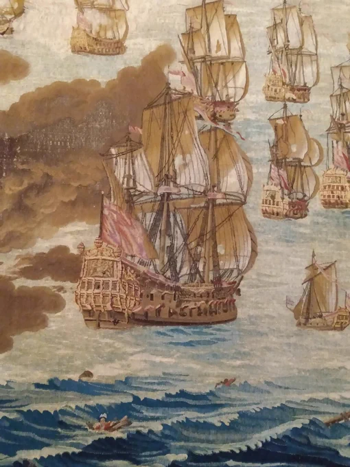 Detail from the restored Solebay tapestry showing boats with their rigging and people adrift in the waves