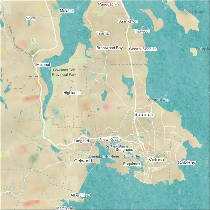 This is an image showing an aerial map view of Victoria, British Columbia, and the surrounding region. The land mass of Canada has been turned a fluffy-textured beige and multicoloured “fun-fetti” vanilla cake texture. Buildings and roads are symbolized in a way that resembles white buttercream frosting. The oceans and water bodies are symbolized with a spongey turquoise texture. 