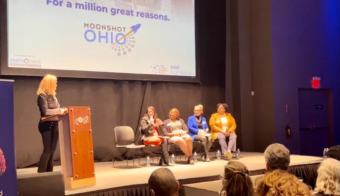Pictured (from left to right): At podium, Teresa Drew, Deputy Director, STEM Next Opportunity Fund. Seated: Stephanie Siddens, Interim Superintendent of Public Instruction, Ohio Department of Education; Sheila James, STEM Consultant, Ohio Afterschool Network; Michele Ritchlin, Executive Director, Ohio Afterschool Network; Latoyia Mosley, Youth Experience Director, YMCA of Central Ohio