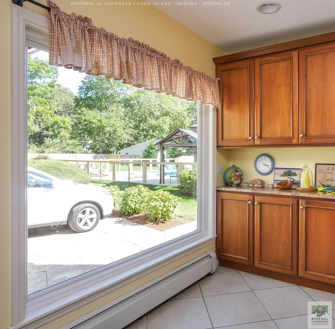 Fabulous kitchen with large new picture window we installed. This huge new window looks out on a large back yard and provides dramatic style and superb energy efficiency. Replacing your home windows is just a phone call away with Renewal by Andersen of Long Island, serving Suffolk, Nassau, Queens and Brooklyn.
