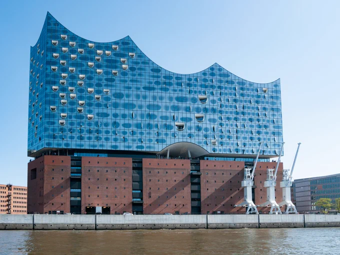 Elbphilharmonie in Hamburg, a distinctive architecture whose overall shape is a cube with spheres carved out of the top. Photo by Matti Blume