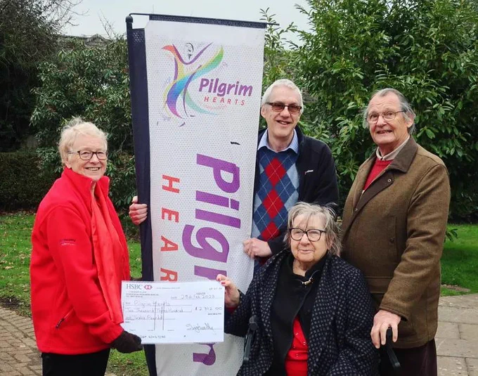 Ann Shaw, the Chair of Sing Healthy, presents a donation cheque to Pilgrim Hearts Trust