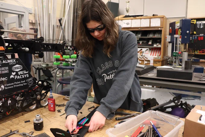Student using Allen keys.