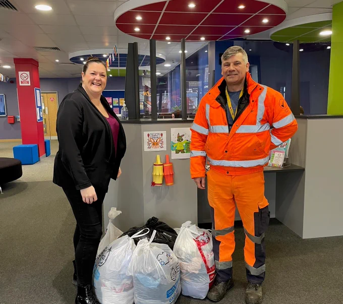 Susanne from The Suit Works, a local charity, and Chris, one of our Area Highways Reps, with 6 bags of unwanted work clothing donated by our employees.
